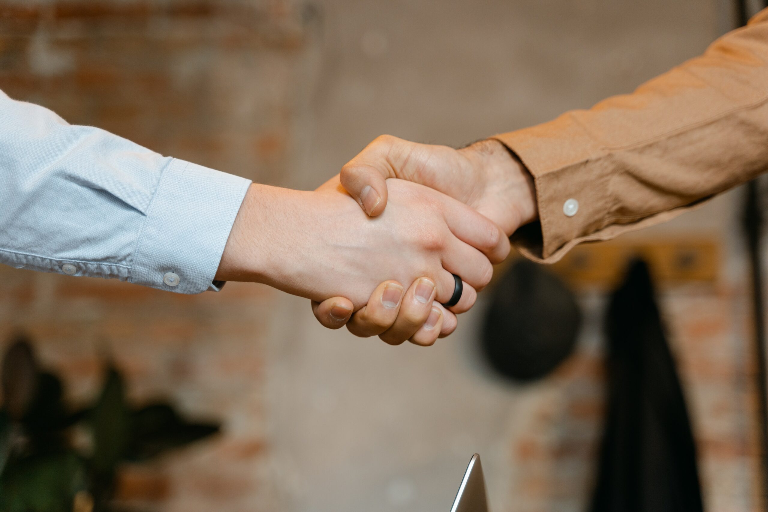 Photo by MART PRODUCTION: https://www.pexels.com/photo/close-up-shot-of-a-handshake-7255731/